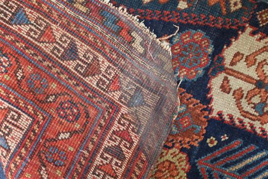 Two red and blue ground rugs, 120 x 90cm & 120 x 100cm